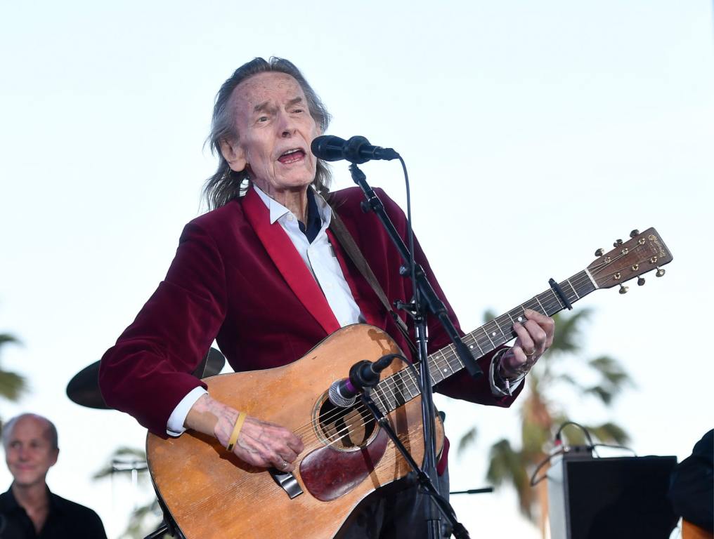 Gordon Lightfoot playing an acoustic guitar