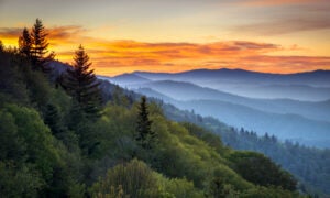 Great Smoky Mountains National Park Scenic Sunrise Landscape at Oconaluftee. This story is about the best honeymoon destinations.