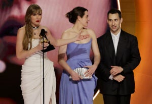 LOS ANGELES, CALIFORNIA - FEBRUARY 04: (L-R) Taylor Swift, Laura Sisk, and Jack Antonoff accept the Album Of The Year award for “Midnights” onstage during the 66th GRAMMY Awards at Crypto.com Arena on February 04, 2024 in Los Angeles, California