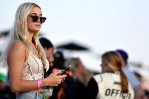 US gymnast and social media personality, Olivia "Livvy" Dunne looks on during the NASCAR Cup Series Ally 400 at Nashville Superspeedway. This story is about who are the top-earning athletes in college sports?