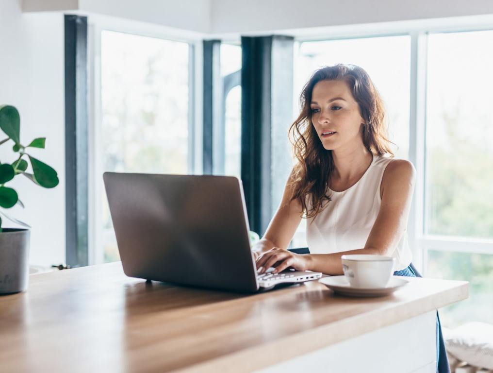 A woman on a laptop.