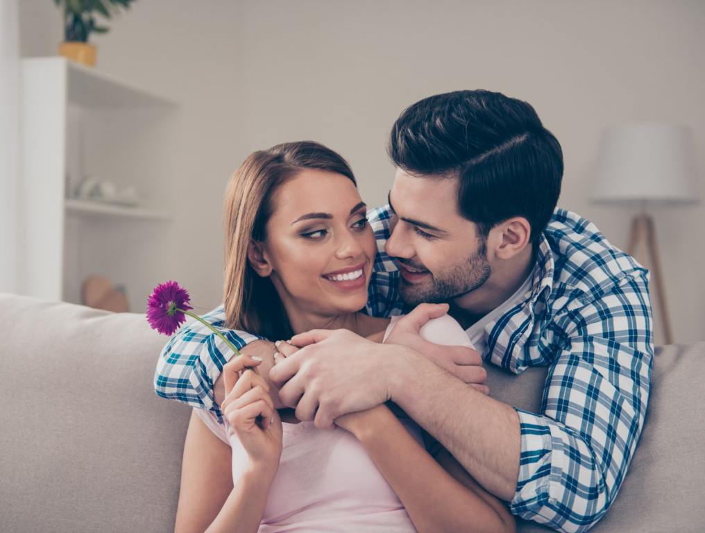 Happy couple with man giving woman a rose. Some experts and phycologists believe that your birth order has a lot to do with finding your perfect mate.