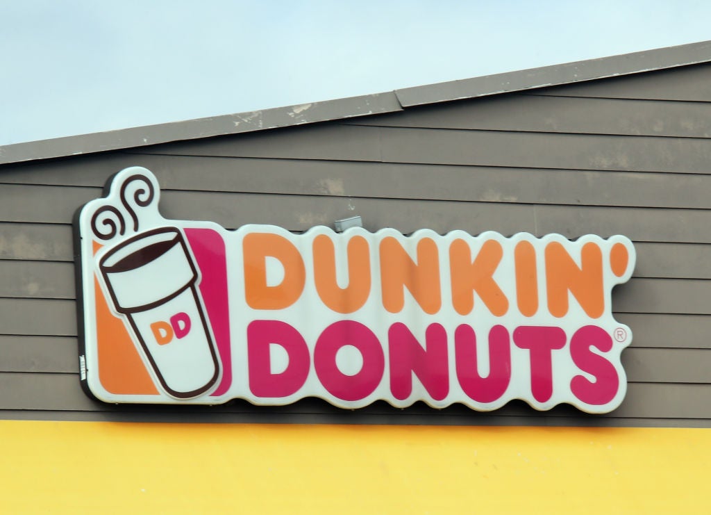 Dunkin' Donuts sign at a location. Woman Gives Birth On Highway, Husband Cuts Umbilical Cord In Dunkin' Parking Lot