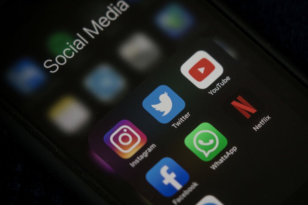 Social media apps on an iPhone. Man Suing Instagram, YouTube, And TikTok For Being 'Too Addicting'