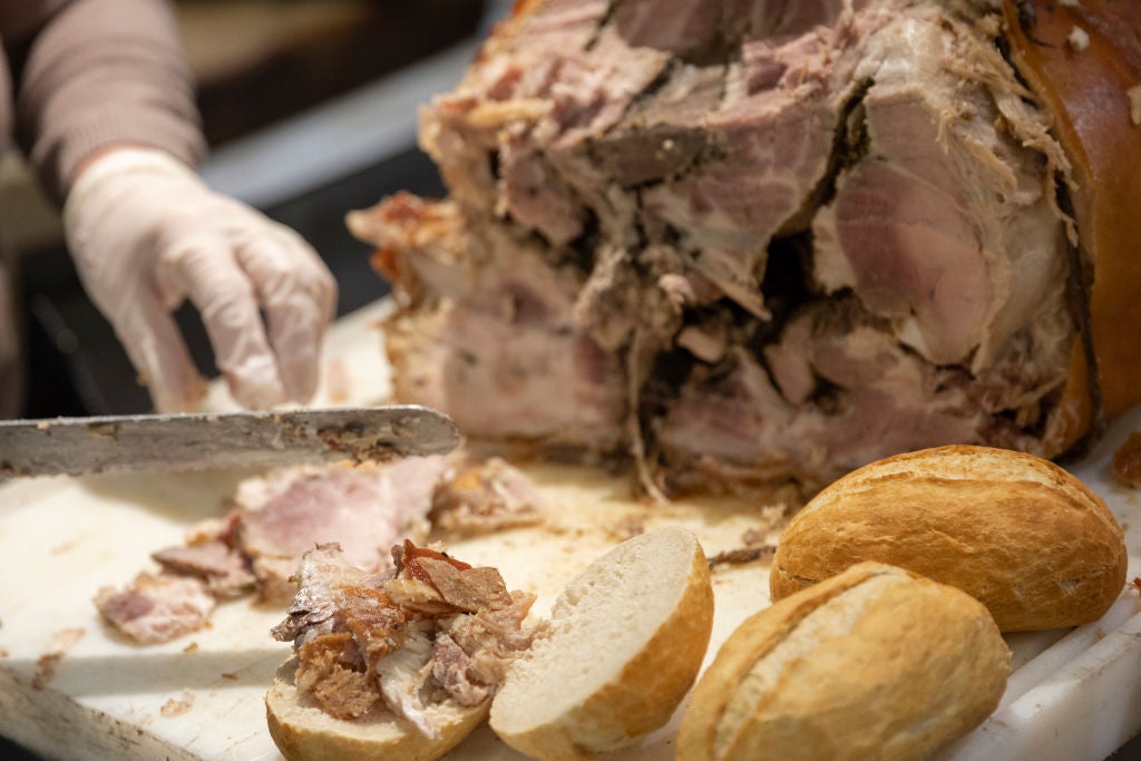 chef slicing up meat for a sandwich as we learn of a new Peruvian sandwich shop in South End