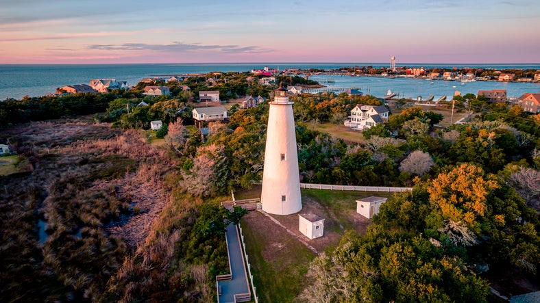 Outer Banks Ocracoke Lighthouse on Ocracoke , North Carolina at sunset.The lighthouse was built to help guide ships through Ocracoke Inlet into Pamlico Sound.