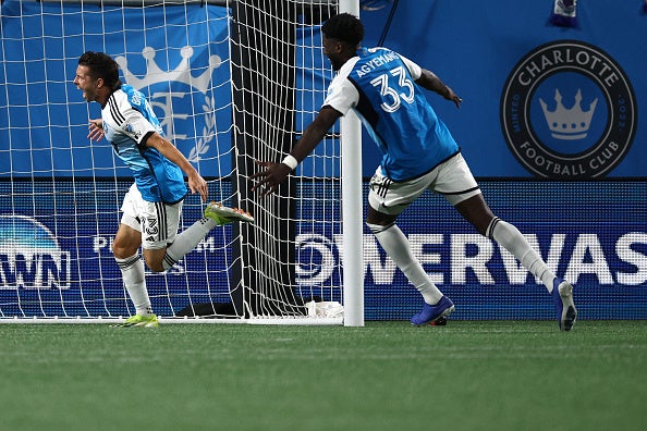 Charlotte FC - Brandt Bronico #13 and Patrick Agyemang #33 of Charlotte FC celebrate a goal scored by Bronico during the second half of the game against the Orlando City SC at Bank of America Stadium