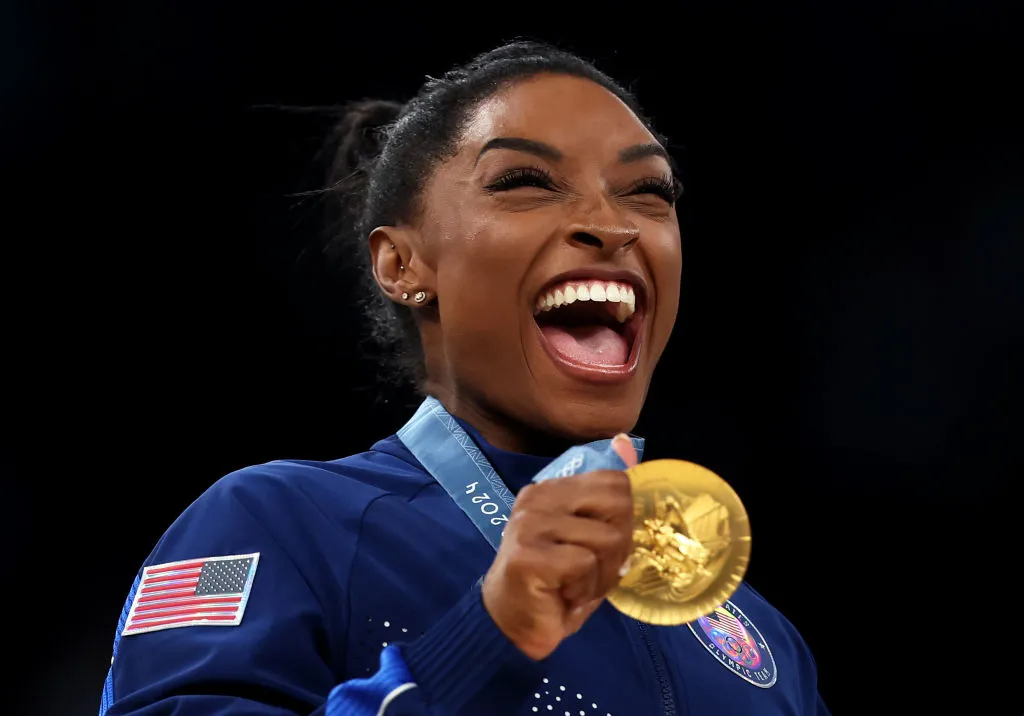 Gold medalist Simone Biles of Team United States celebrates on the podium during the medal ceremony for the Artistic Gymnastics Women's Team Final on day four of the Olympic Games Paris 2024 at Bercy Arena. Team USA Olympic winners get paid from the U.S. Olympic and Paralympic Committee if they get a medal. Here's what they earn.