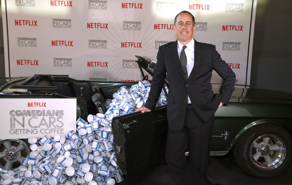 Jerry Seinfeld posing with a car full of empty coffee cups for Comedians In Cars Getting Coffee on Netflix. 5 Underappreciated Episodes Of 'Comedians In Cars Getting Coffee'