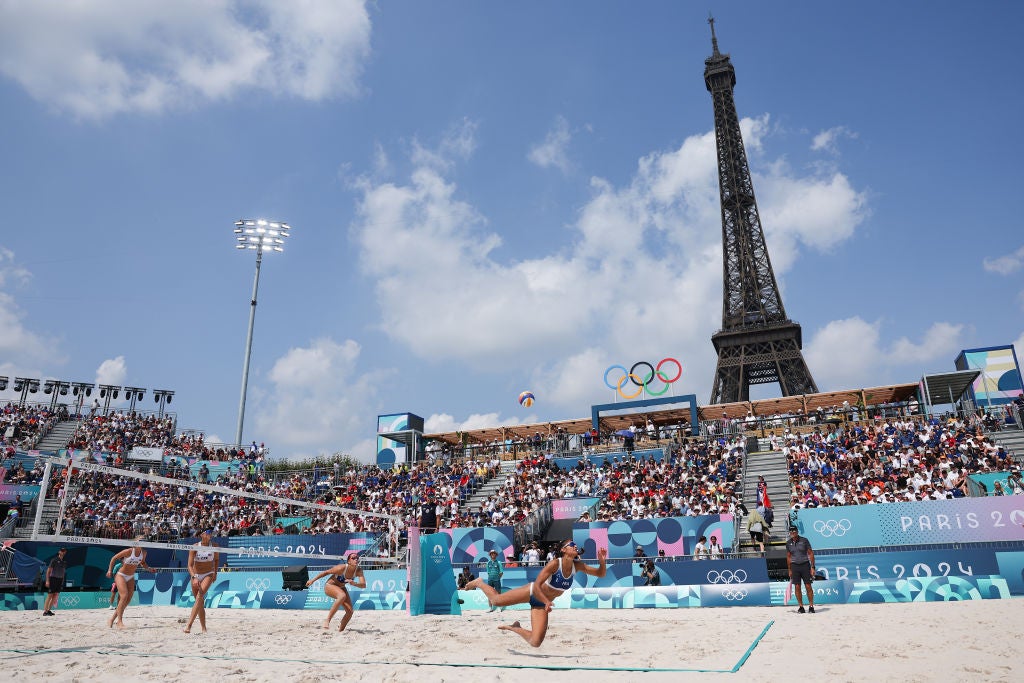 General view inside the arena as Clemence Vieira of Team France competes as the Eiffel Tower is seen in the background during the Men's Preliminary Phase - Pool B match between Team France and Team Czechia on day seven of the Olympic Games Paris 2024 at Eiffel Tower Stadium