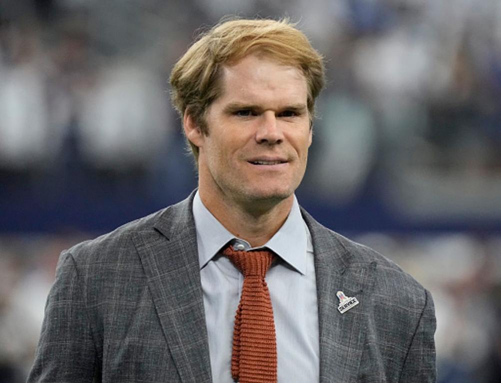 Football broadcaster Greg Olsen walks the field before the game between the New York Giants and Dallas Cowboys at AT&T Stadium on November 12, 2023 in Arlington, Texas.