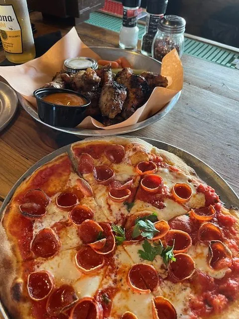 pizza and wings at Pizza Hyena at Surfside Beach as we learn about a Conway South Carolina man eats out every day