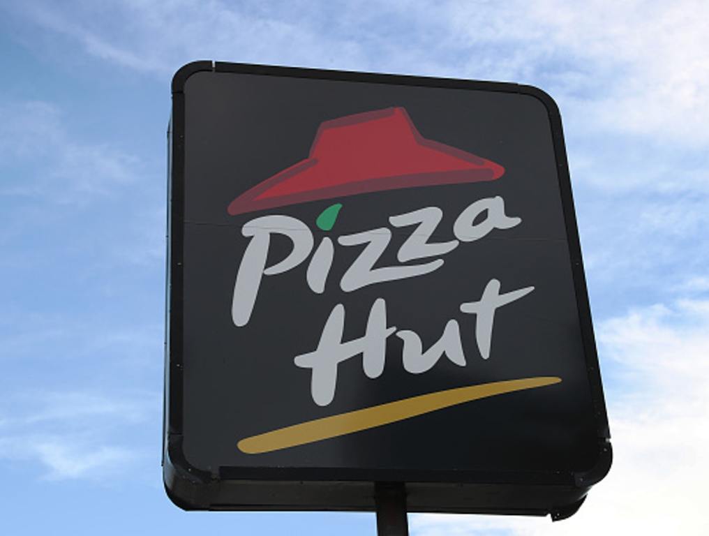 A sign is seen at a Pizza Hut restaurant