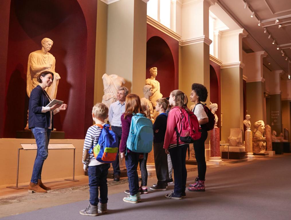 The interior of. museums with people standing in it.