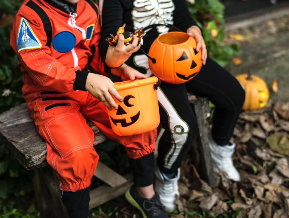 Kids in costume with thier Halloween candy.