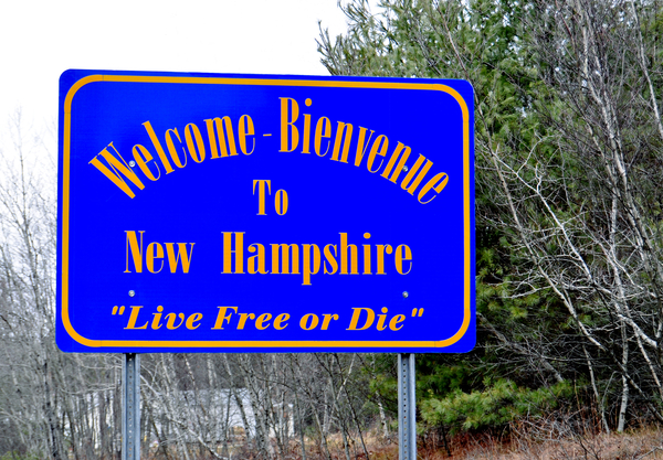A sign welcoming you to the great state of New Hampshire. Taken in Massachusetts at the town line of Fitzwilliam, NH.