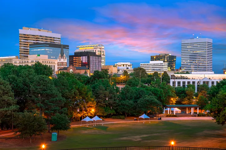 Columbia, South Carolina, USA downtown city skyline from Finlay Park at dusk.
