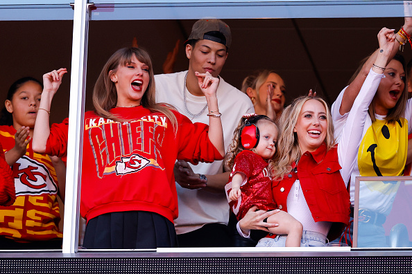 KANSAS CITY, MISSOURI - OCTOBER 22: Taylor Swift and Brittany Mahomes celebrate a touchdown during the second quarter of the game between the Kansas City Chiefs and the Los Angeles Chargers at GEHA Field at Arrowhead Stadium on October 22, 2023 in Kansas City, Missouri. 